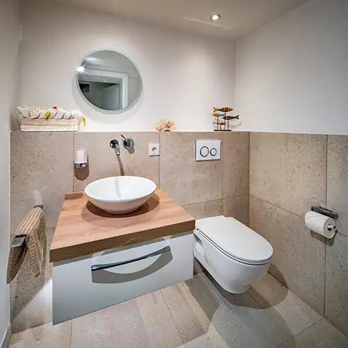 Gästetoilette mit rundem Waschbecken